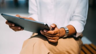Woman+holding+a+tablet
